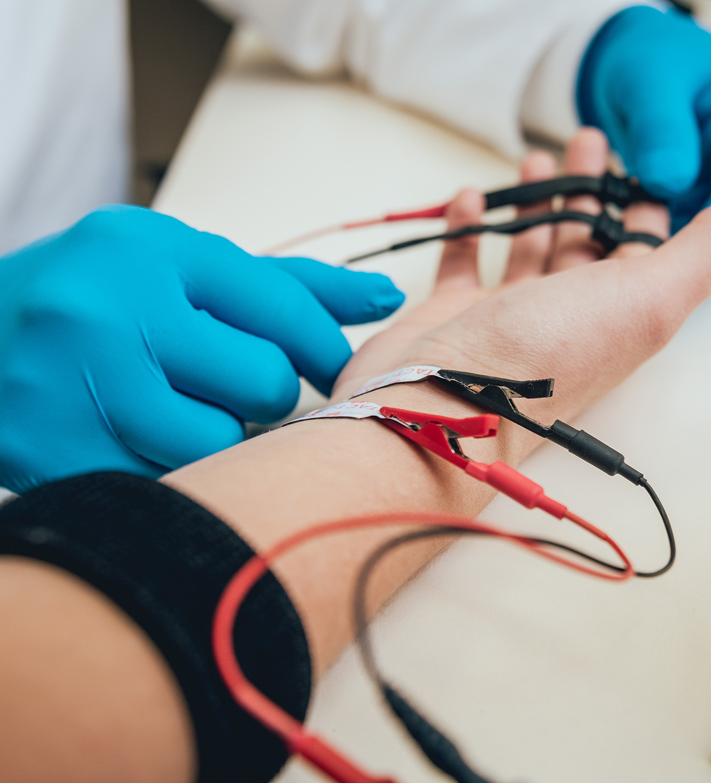 Image of a person's arm hooked up to EMG equipment